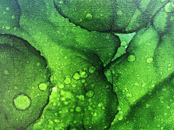 close-up of alcohol ink painting of abstract jungle leaves